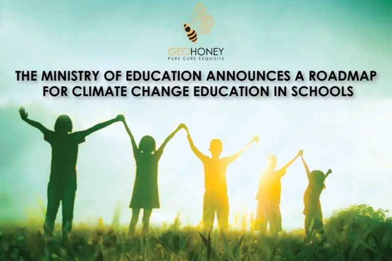 A group of students holding hands, standing on a green landscape with trees and a blue sky in the background. "The Ministry of Education announces a roadmap for climate change education in schools".